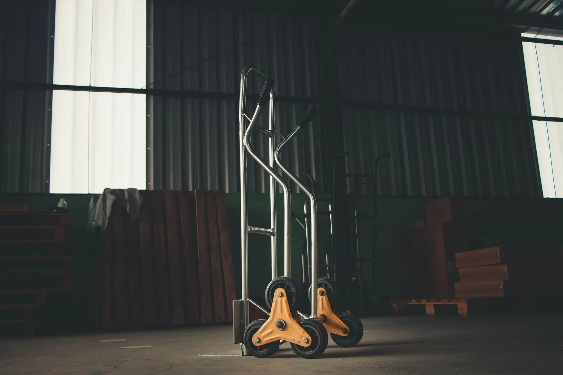 A hand truck standing in the loading bay